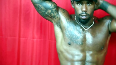 Muscular black man in cap gives handjob commands with dominant presence