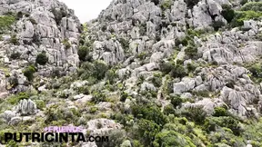 Asiab Babe Putri Cinta strips down and takes a daring walk atop a towering peak.