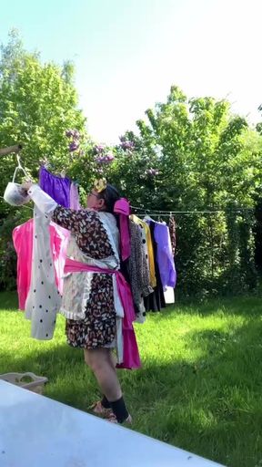 In gardening outfit to hang the laundry outside