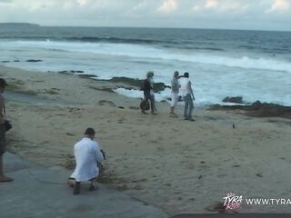 Blond in Car During Exposed Beach Film Shoot with Crew