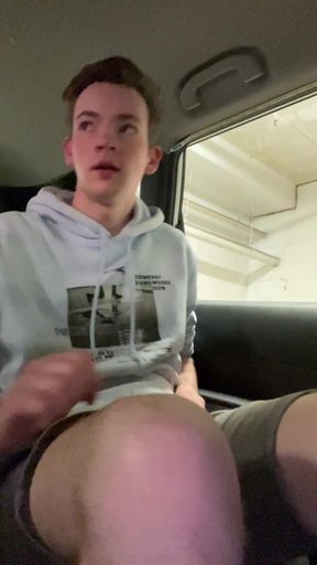 Slim twink plays with a butt plug while sitting