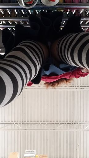 Woman in striped stockings taking selfie