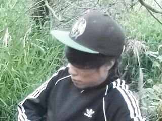 Cute Oriental homo twink in a ebony-and-white adidas tracksuit and Campus sneakers masturbates and cums outdoors