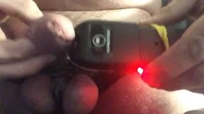 Close up stun gun used on tightly bound cock and balls
