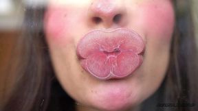 pillow-soft glossed lips in a melting sensual kiss