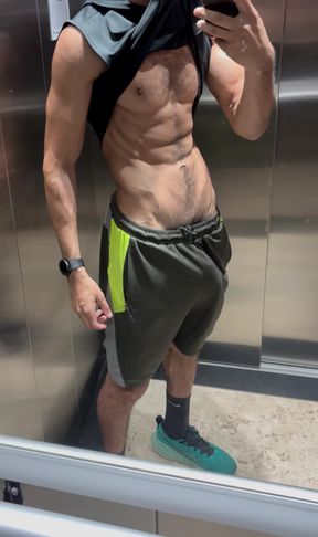 Hairy fitness guy showing off his thick cock in the elevator without underwear