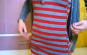 Cute teen ts does a little softcore posing for the cam