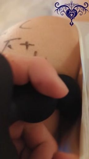 She was fucked with a vibrator and had balls inserted into her anus in a naughty leotard.