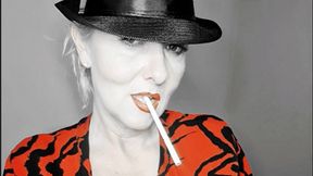 Smoker Queen Joan takes a pleasurable drag on her 120 Eve, many open mouth inhalations with lots of creamy white smoke surrounding her red lips*hat fetisch*red lips*close up*special filter*