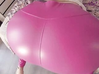 Strap and large round natural butt also taut in hot pink leggings!