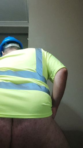 Construction bear stroking and shooting a load