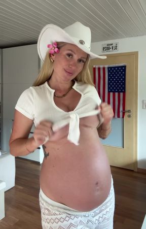 Pregnant woman in cowboy hat