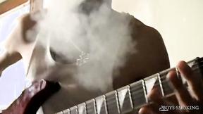 ”BoysSmoking: Axel Smokes Heavy While Rocking Out & Stroking His Cock”