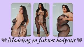 Modeling in fishnet bodysuit