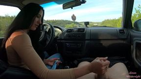 Hot black-haired girlfriend gives handjob on public road