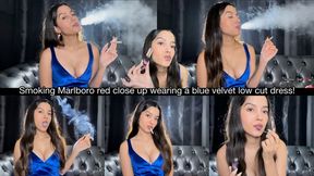 Smoking Marlboro red close up wearing a blue velvet low cut dress!