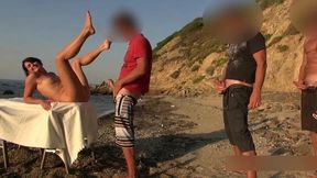 Brunette MILF is having much fun on the beach with 3 men during her vacation