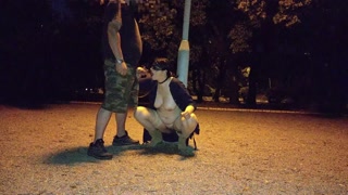 A submisive slut takes a piss in her mouth in a public park