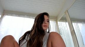 The girl caresses her wet pussy