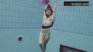 Smoking hot Russian redhead in the pool