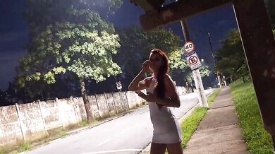 Redhead tightens her legs as she risks getting caught sucking off at the bus stop