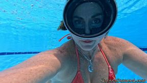 Carissa in her new bikini in the resort pool with face mask fill and clear