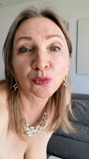 Busty hot granny teases and plays with her pussy