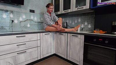 Mature Redhead Iris Showing Legs and Feet In Tan Pantyhose Tease