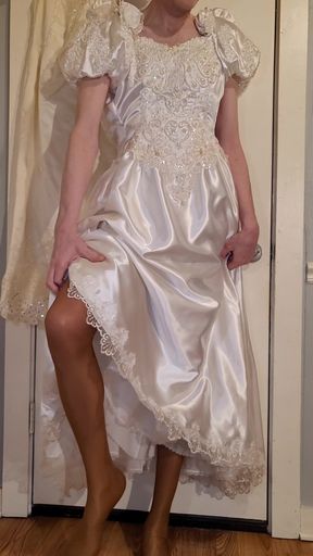 Trying on a liquid satin wedding dress.