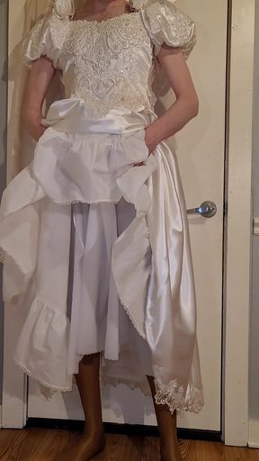 Trying on a liquid satin wedding dress.