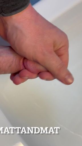 Ginger jerks off in the bathroom at work