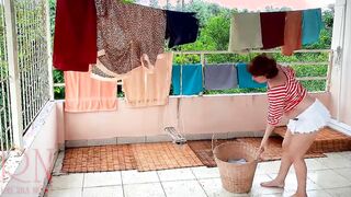 Nude laundry. The maid is drying clothes inside the laundry.