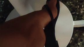 Hanging up the sandals while at a large party (1)