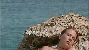 Horny Redhead Babe Fingers Pussy on Wild Beach