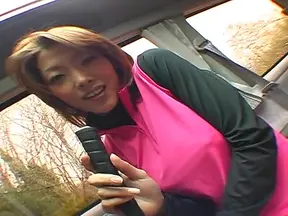 Busty teen plays with cock while in the car