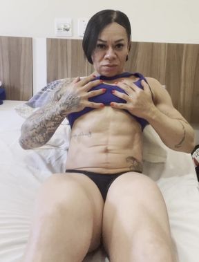 Busty MILF shows off her muscles