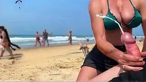OLDER WOMAN gives a sloppy sucking on the beach