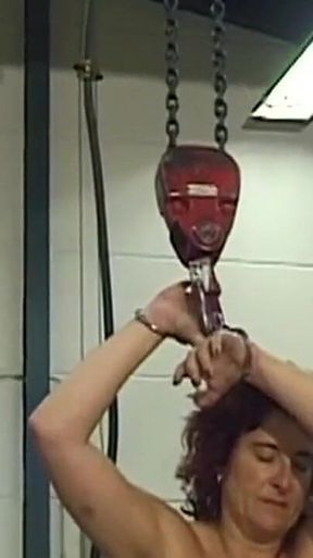 Mature Redhead MILF Endures Needles and Heavy Weights