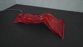Relaxing inside a soft red vacuum bed made of natural latex Sonya arched as she pleased
