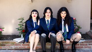 Two goth chicks share a friend's cock on the Halloween