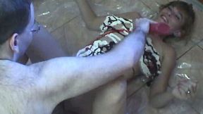 Mature flabby whore masturbates with banana on the messy floor