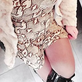 Crossdresser in fur and high heel boots