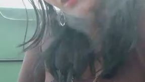 Smoking in the blowing wind.