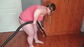 Pigtailed pale BBW gets undressed to vacuum suck her big boobs and fat pussy