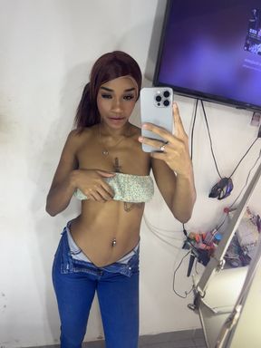 Latin teen shows off her perky tits in a solo striptease
