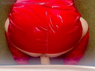 Sissy floozy in red pvc costume riding sex-toy with ejaculation
