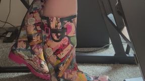 Energetic Comic Book Rain Boots Stomping And Pumping Piano Pedal With Leg Shaking