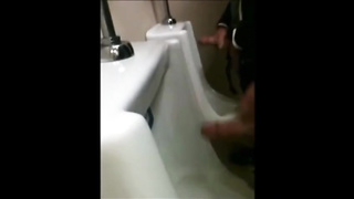 two slim dicks getting wanked at the urinals 5