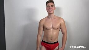 Muscle boy Jonathan Hicks shows his abs