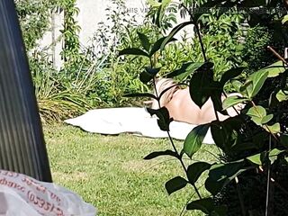 I spy on my stepmother, that babe's sunbathing stripped in the yard